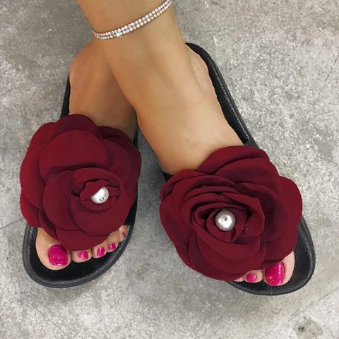 Fashion lady with big flower sandals