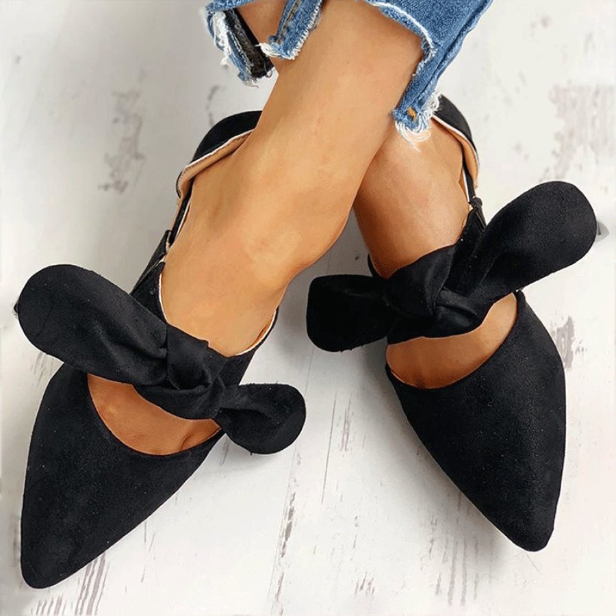 Pointed cutout bow flat shoes
